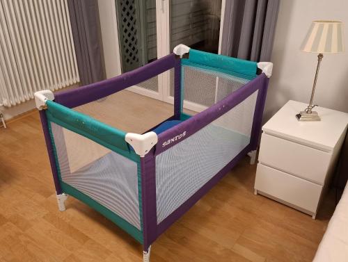 a purple and blue bunk bed in a room at Ferienwohnung Weserperle in Nordenham