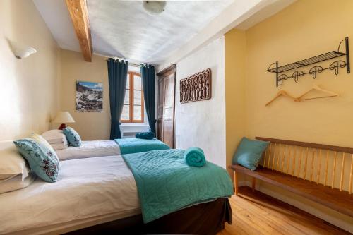 En eller flere senge i et værelse på La Petite Maison des Montagnes