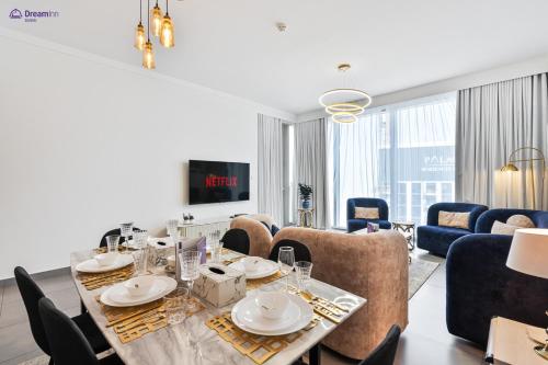 a dining room with a table and chairs at Dream Inn Apartments - Dubai Creek Harbour in Dubai