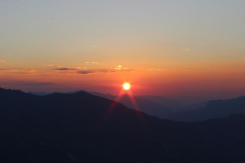 a sunset on the top of a mountain at Ferienwohnung Irene in Tux