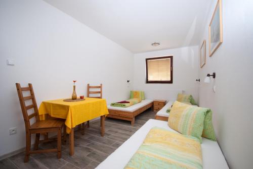 a living room with a couch and a table at Areál Přístav in Horní Soběšovice