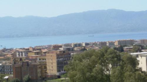 a city with buildings and a body of water at Bed and Breakfast Oasi in Reggio Calabria
