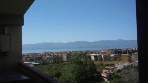 a view of a city with the ocean in the background at Bed and Breakfast Oasi in Reggio Calabria