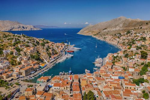 an aerial view of a harbor with boats in the water at Lemonitissa Villa in Symi