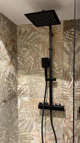 a microphone on a stand in front of a wall at My Life in Palermo