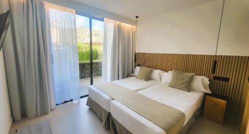 Posteľ alebo postele v izbe v ubytovaní Hotel Bahia Pollensa