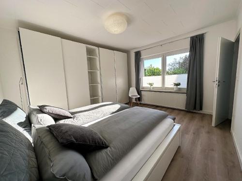 Ένα ή περισσότερα κρεβάτια σε δωμάτιο στο Ferienhaus Libelle