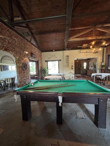 a large room with a pool table in it at Pousada Charqueada Costa do Abolengo in Pelotas