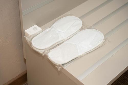 a plastic shelf in a room with a toilet at Terrenkur boutique-hotel in Almaty