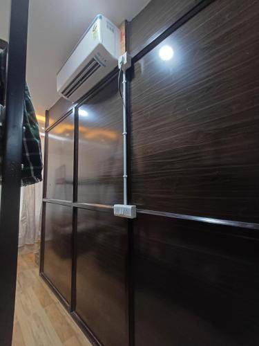 a black refrigerator with a light on top of it at Janki Guest House in Sambalpur