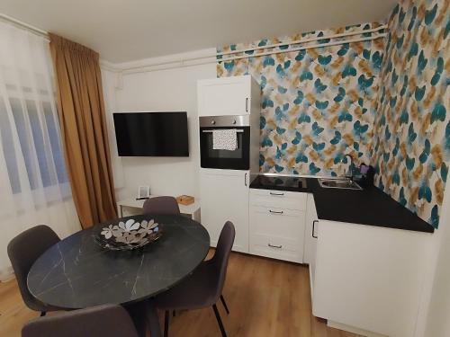 Η κουζίνα ή μικρή κουζίνα στο Apartmani Venium