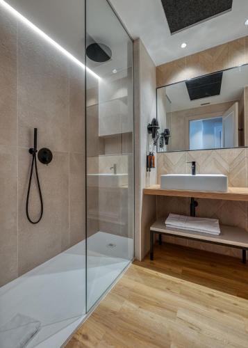 a bathroom with a shower and a sink at Senator Cádiz in Cádiz