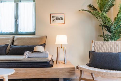 a living room with a couch and a chair at Villa Aurora in Athanion