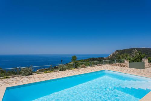 a swimming pool with a view of the ocean at Villa Aurora in Athanion