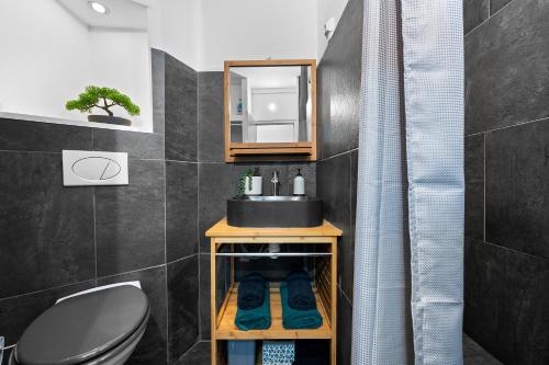 a bathroom with a sink and a toilet at LaPlage - A 50m de la Plage-Restos-Bars-Ville in Saint-Paul