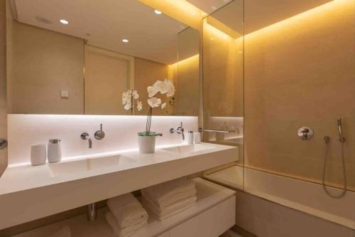 a bathroom with a large sink and a shower at 812 ALM Luxury aparment in Palo Alto, Marbella in Ojén