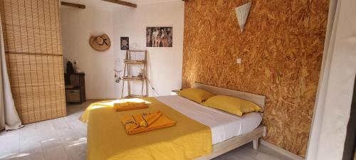 Postel nebo postele na pokoji v ubytování Zananas Bungalow privé chez l'habitant