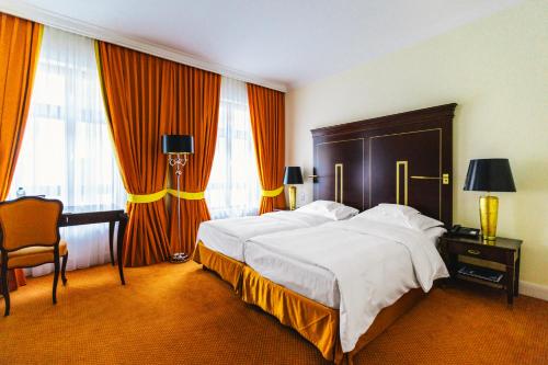 Postel nebo postele na pokoji v ubytování Relais & Châteaux Bülow Palais