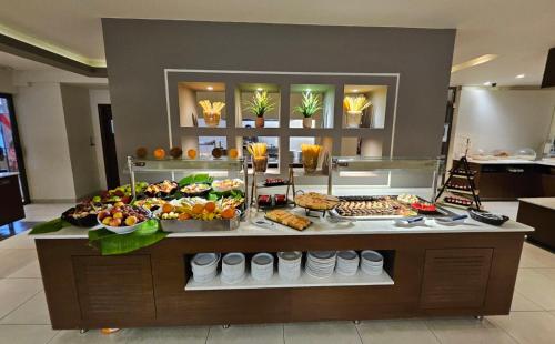 a buffet with many different types of food on display at Cosmopolitan Hotel in Kos Town