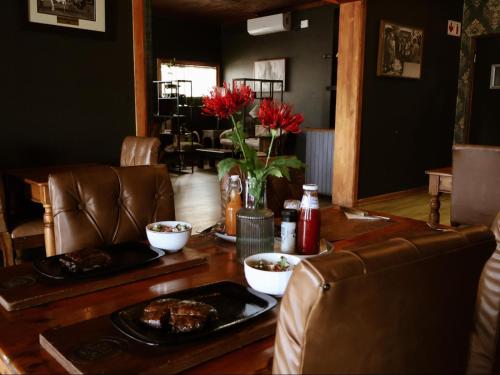a living room with a table with food on it at The Wooden Spoon Guesthouse in Bethlehem