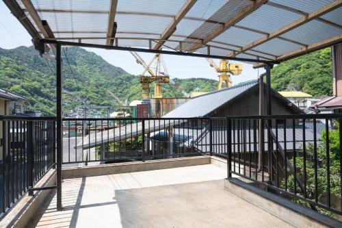 a view from the balcony of a building at 一棟貸し宿 松本邸 in Kinoe