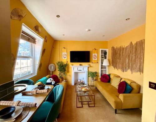 a living room with a couch and a table at London Chinatown Apartments in London
