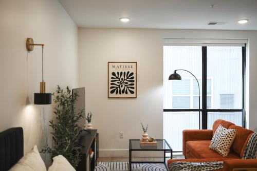 a living room with a couch and a table at LUX Studio King Bed Gym Free Parking in Pittsburgh