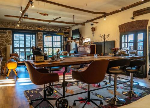 a large kitchen with a large wooden table and chairs at DVOR 13 Hokovce in Hokovce