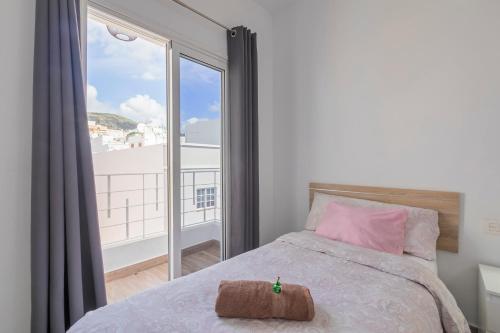 Ένα ή περισσότερα κρεβάτια σε δωμάτιο στο TENERIFE URBAN ROOMS