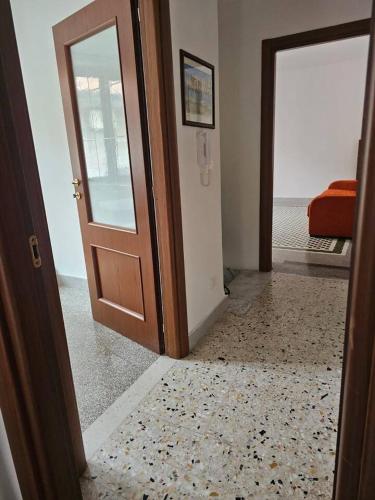 an open door to a room with a carpet at Tra Mare e Terra Reggio Calabria in Lazzaro