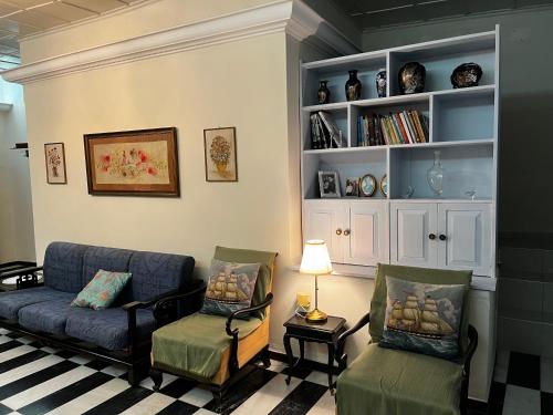 a living room with a couch and two chairs at Villa by the Sea, Nyfida Lesvos in Nifida