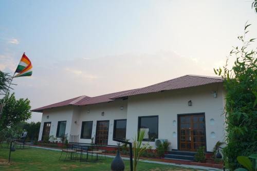 a house with a kite flying in the sky at Sundervan Vilas Ranthambore in Khilchipur
