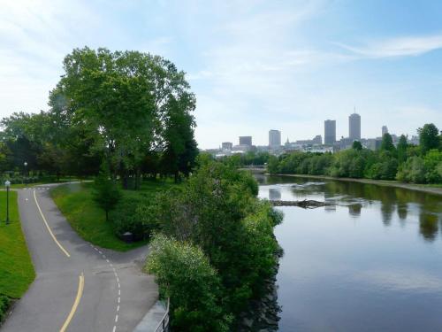 a view of a river with a city in the background at Quebec city Downtown River Sidewalk 2 Free Parking in Quebec City
