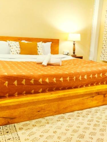 a bed in a hotel room with at Pranati Homestay in Kalimpong