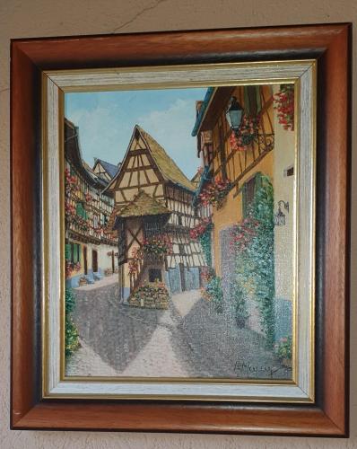 a picture of a painting of a building at Gîte Les Bleuets in Eguisheim