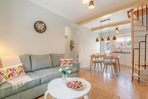 a living room with a couch and a table at HostWise - Quinta do Vintém w/ Terrace near WOW in Vila Nova de Gaia