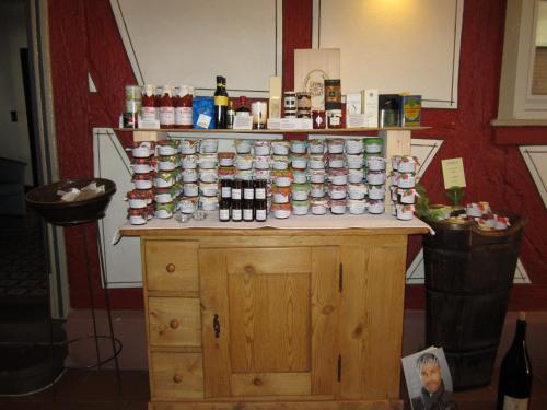 a counter with a bunch of cups on it at Hotel Weinhaus Stern in Buergstadt