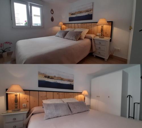 una camera da letto con due letti e uno specchio di Casa de mis padres a Rincón de Soto