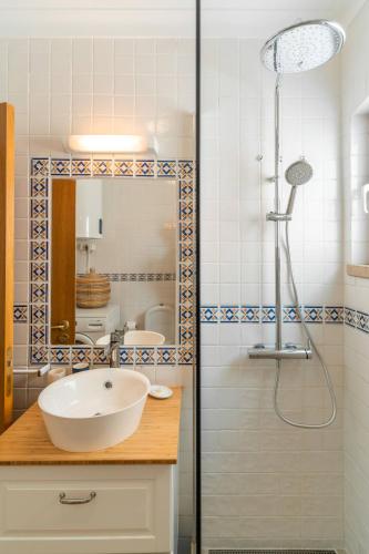 a bathroom with a sink and a shower at LV Premier Troia in Troia