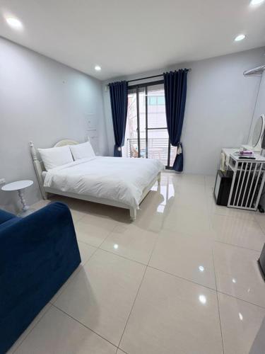 Postel nebo postele na pokoji v ubytování Kaohsiung Raifong Corner Homestay