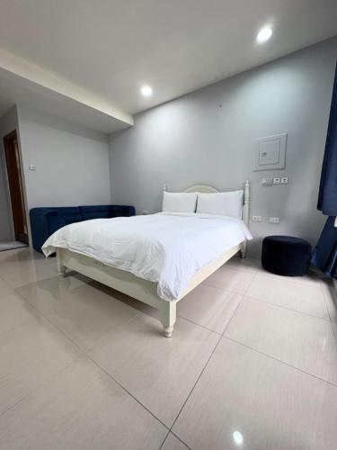 Postel nebo postele na pokoji v ubytování Kaohsiung Raifong Corner Homestay