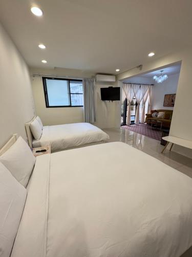 Voodi või voodid majutusasutuse Kaohsiung Raifong Corner Homestay toas