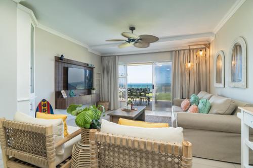 a living room with a couch and a table at La Mustique 4 in Ballito