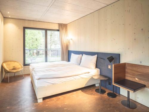 Postel nebo postele na pokoji v ubytování Lodge Hof Weissbad