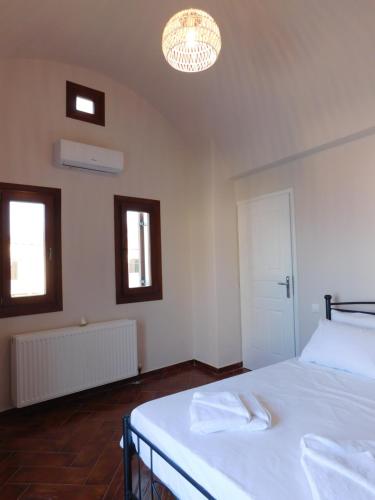 Postel nebo postele na pokoji v ubytování Demi's House