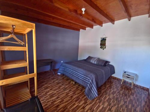 Cama ou camas em um quarto em Hostal Perita