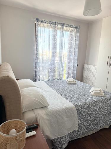 a bedroom with a bed and a window at HomeAway Pescara Airport in San Giovanni Teatino
