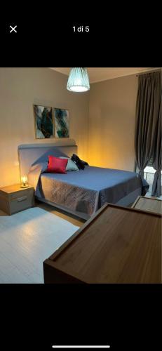 a bedroom with a bed with two pillows at Luxro Home Crotone in Crotone