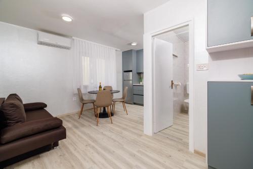 a living room with a couch and a table at Durasin in Crikvenica