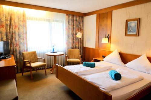 Postel nebo postele na pokoji v ubytování Natur & Wander Hotel Gassbachtal
